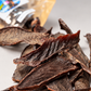 Close up of dehydrated beef heart dog treat strips