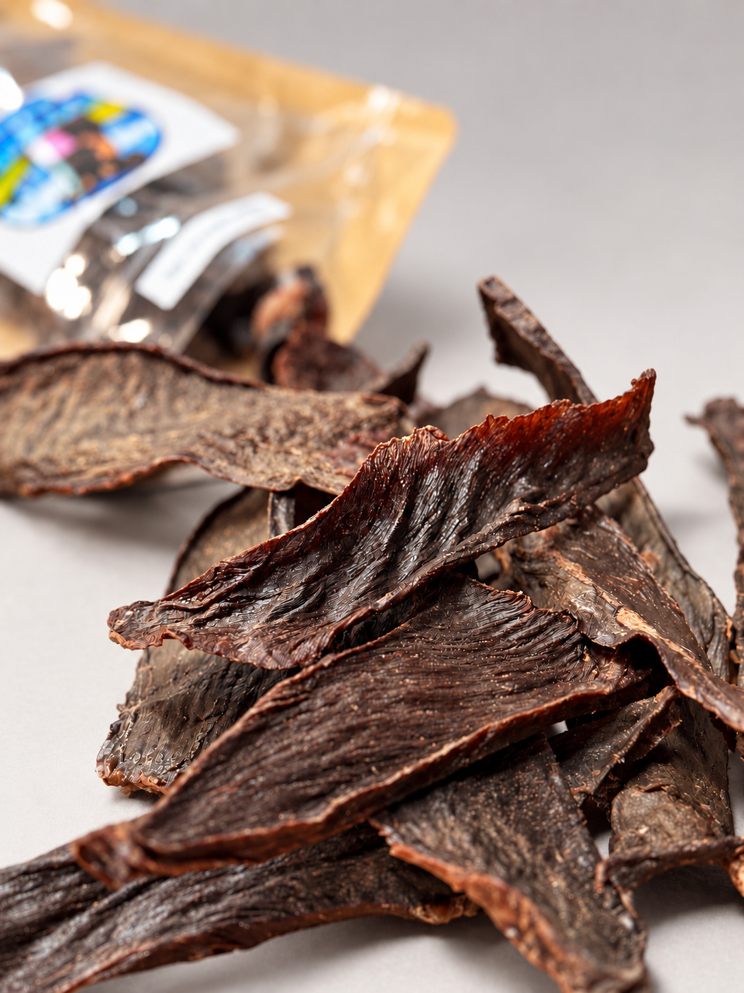 Close up of dehydrated beef heart dog treat strips